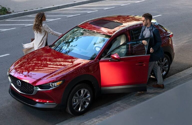 Two people getting into a 2020 CX-30