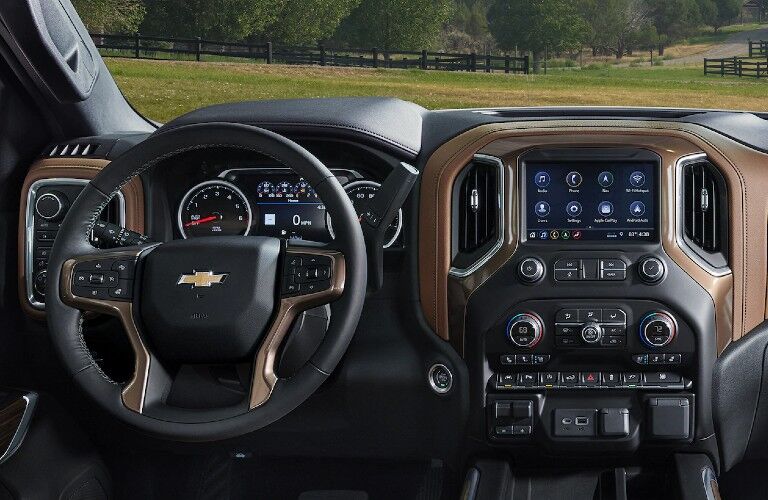Close up of the steering wheel and touchscreen inside the 2020 Chevrolet Silverado 1500
