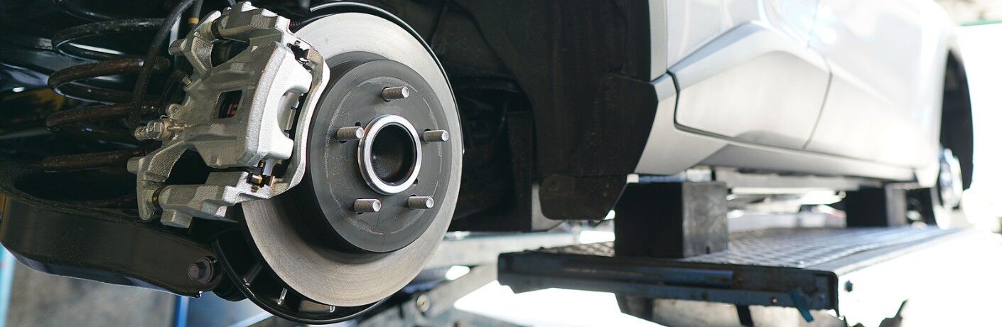 Close up of the brake disc on a white car