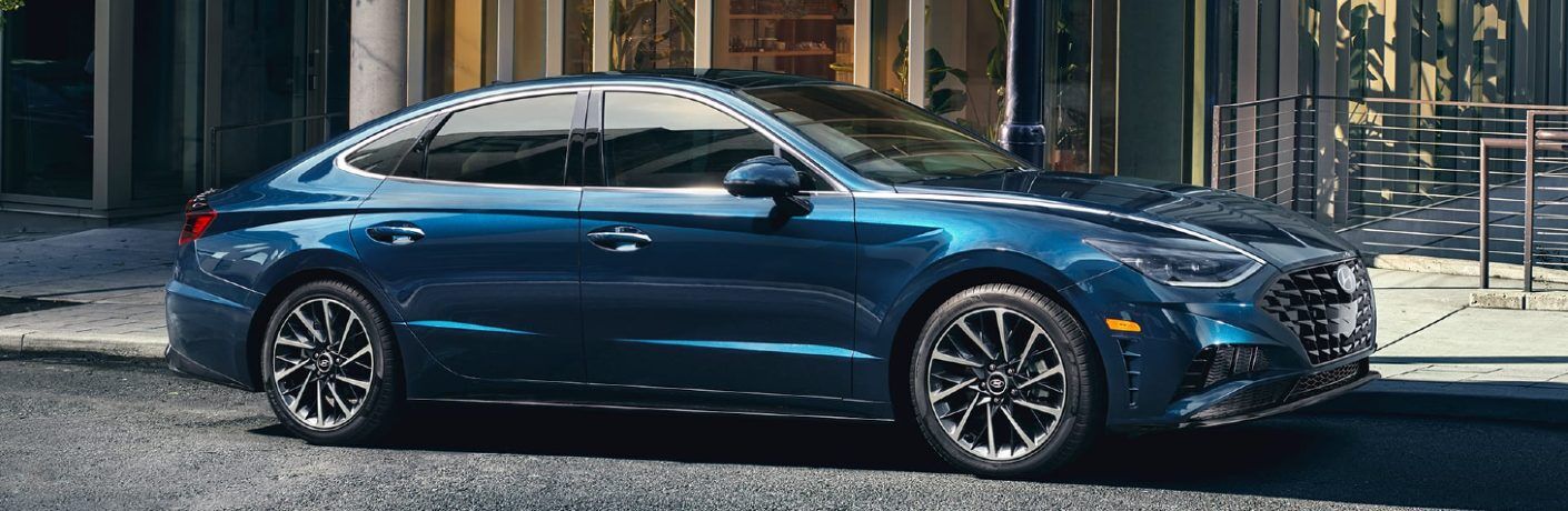 Front passenger angle of a blue 2020 Hyundai Sonata parked on a street