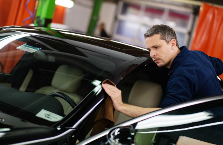 mechanic polishing car