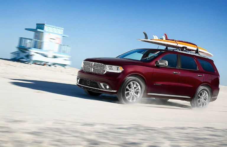 A photo of the 2020 Dodge Durango driving on the beach.