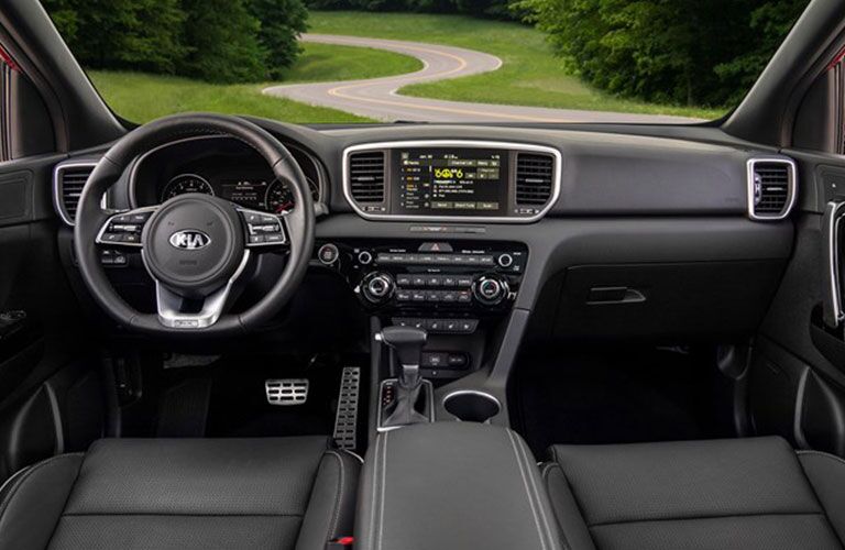 Interior view of the front seating area inside a 2020 Kia Sportage
