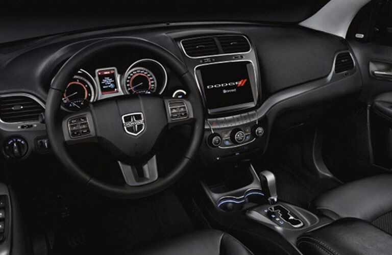 2019 Dodge Journey interior shot of steering wheel, infotainment, and dashboard layout