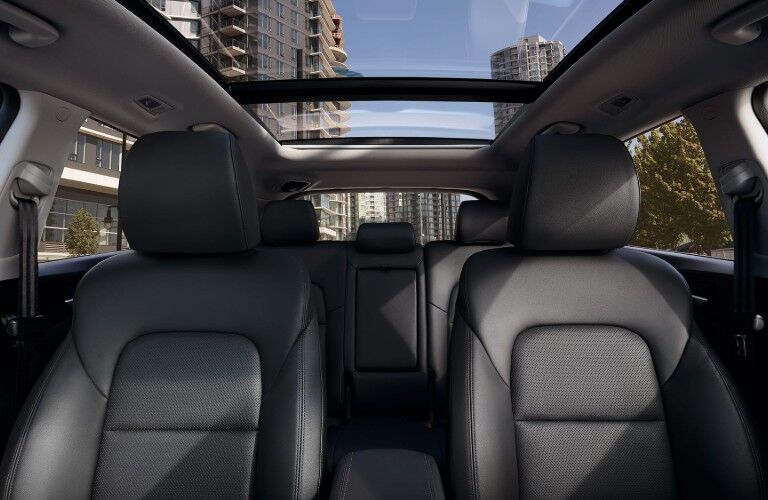 Angle from the front of a 2020 Hyundai Tucson showing the seats and sunroof